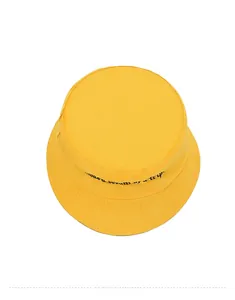 Top-down view of yellow cotton bucket hat featuring black 'it was a dream of a trip' embroidery