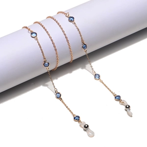 Golden eyewear chain with blue crystals and anti-slip rubber loops for sunglasses