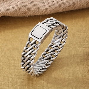 Detail of vintage square woven titanium steel bracelet with a magnetic clasp closure
