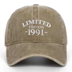 Detailed view of the 1991 Limited Edition white 3D embroidery on washed khaki cotton cap