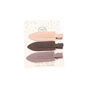 Three-piece matte duckbill hair clips set in pink, brown and greyish purple for women