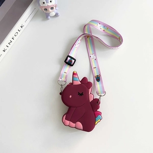 Detail of dark pink silicone unicorn crossbody bag with colorful strap and bubble texture