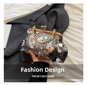 Detail of silver sequin evening clutch bag with gold vintage clasp and metal chain strap