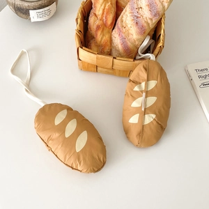 Detailed close-up of baguette-shaped foldable shopping bag charms with realistic textures