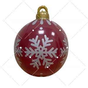 Close-up of inflatable Christmas ball with silver snowflake patterns and golden top hook
