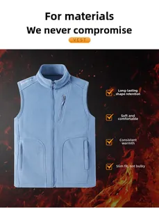 Detail of blue polar fleece vest showing zipper pockets and high collar thermal fabric