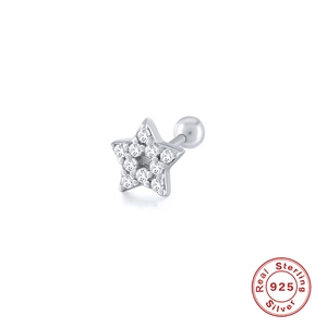 Macro detail of star shaped 925 silver stud earring with cubic zirconia and screw back ball