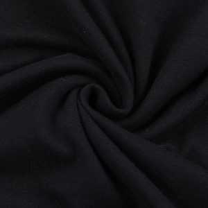 Close-up detail of black lace dress showing delicate spiral pleated fabric and soft texture