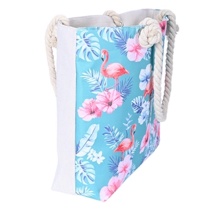Side view of canvas beach bag with pink flamingo prints and thick hemp rope handles