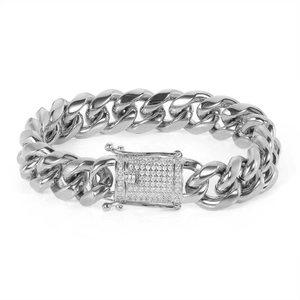 Macro detail of silver Cuban link bracelet with iced-out zircon square clasp