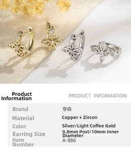 Detail view of cross-shaped zircon earrings in silver and light coffee gold finishes