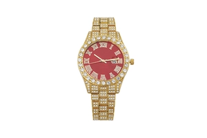 Detail of gold crystal watch with red dial, iced-out rhinestones, and calendar window