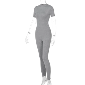 Detail view of grey short sleeve jumpsuit with slim fit design and knit texture