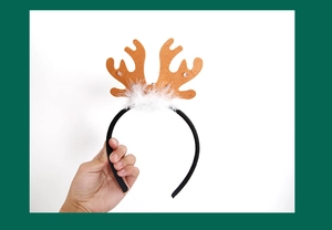 Close-up of LED reindeer antler headband with brown antlers and soft white fur trim