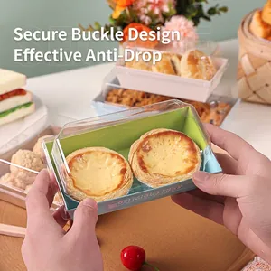 Sandwich paper box with clear plastic lid for desserts and cakes held by hands