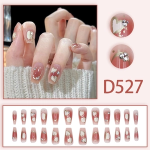 Pink gradient press-on nails with heart designs and glitter rhinestones in 24 piece set