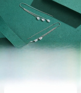 Detail of S925 sterling silver long tassel earrings with 5A grade zircon teardrops