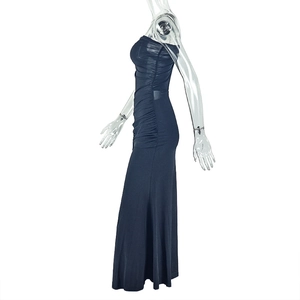 Detail view of ruched side seams and mesh texture on a navy blue bodycon maxi dress