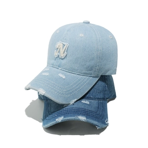 Distressed denim baseball caps in light and dark blue with N letter embroidery patch