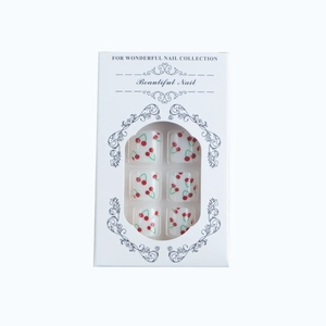 French style press-on toe nails set featuring red cherry patterns on white background