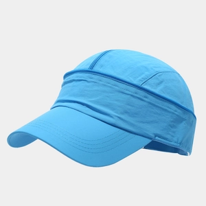 Close-up of bright blue quick-dry baseball cap with functional zipper detail on top