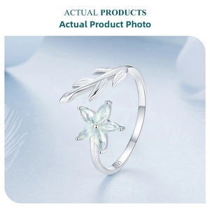 Detail view of the S925 sterling silver stamp on the inner band of the floral ring