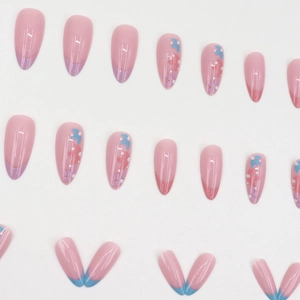 Pink almond press-on nails featuring floral patterns and colorful French tips design