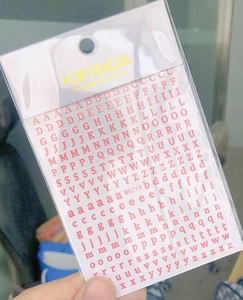 Close-up of pink 3D alphabet nail art stickers model WG719 with varied letters