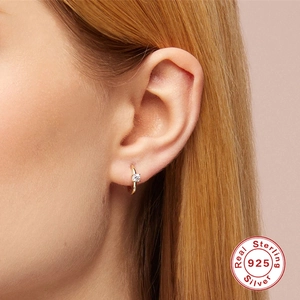 Minimalist S925 sterling silver gold hoop earring with single diamond on female model