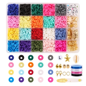 Macro shot of 24-grid clay beads kit with letter beads, shells and elastic strings for DIY