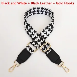 Adjustable black and white houndstooth strap with golden metal hooks for shoulder bags