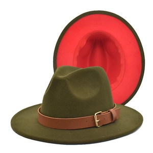 Detail of olive green and red contrast fedora hat with brown leather buckle strap