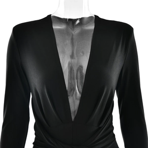 Detail showing the deep V-neckline and ruched waist of the black long sleeve bodysuit