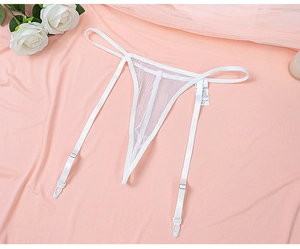 Detailed view of white mesh thong and garter belts with adjustable straps on pink fabric