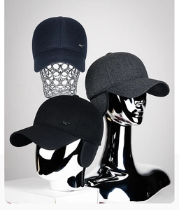 Winter ear protection baseball caps in navy, grey, and black with metal logo detail