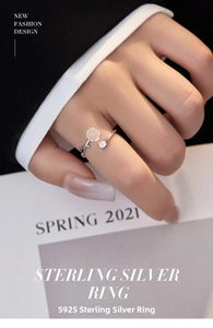 Close-up of S925 silver camellia ring with frosted white rose and sparkling cubic zirconia