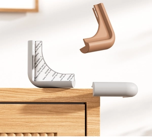 Detailed view of L-shaped silicone corner guards with strong adhesive backing for baby safety