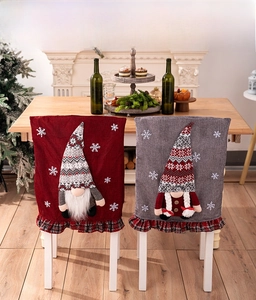 Detail of Christmas gnome chair covers with 3D plush figures and red plaid trim