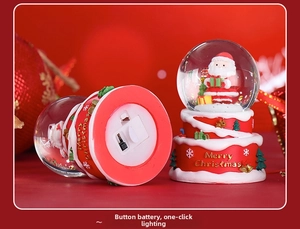 Detail of Christmas Santa snow globe base with button battery slot and light switch