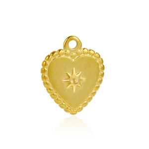 Detailed view of golden heart pendant with embossed star pattern and beaded edge