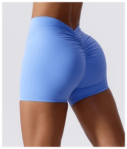 Close-up of light blue scrunch yoga shorts with V-shaped waistband and booty lifting detail