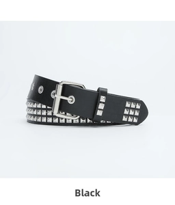 Detailed close-up of punk black leather belt with three rows of silver pyramid studs