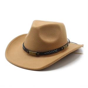 Detail of khaki cowboy hat featuring brown leather band and ornate bronze buckle embellishment