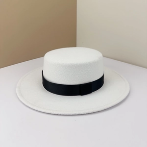 Elegant white flat-top boater hat with a contrasting black ribbon band for women