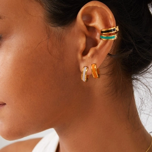 Colorful enamel hoop earrings with 18K gold plating on model in a fashion style