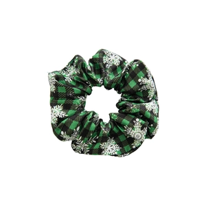 Christmas green plaid scrunchie with white snowflake patterns on a white background