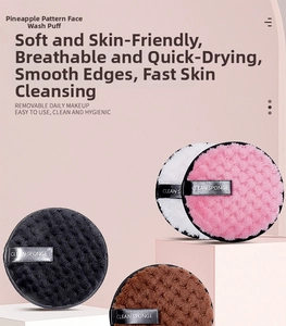 Macro detail of microfiber pineapple texture facial puffs in various colors on pink stands