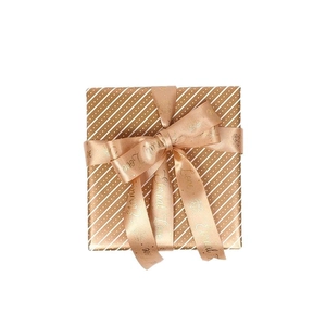 Rose gold gift wrap paper with metallic foil polka dots and branded Eternal Love ribbons