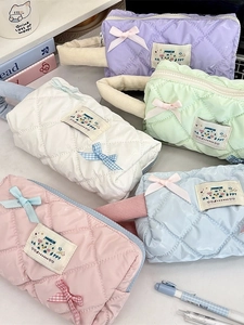 Quilted waterproof stationery bags with bows and handles in multiple pastel colors