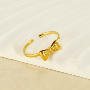 Elegant 18K gold-plated bow-knot open ring with a refined satin finish on a white stand